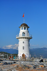 Fototapeta na wymiar lighthouse in the port of Alanya - an attractive tourist attraction
