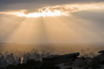 Sun bursting through low clouds near Chatsworth Park South in the San Fernando Valley area of Los Angeles, California.  