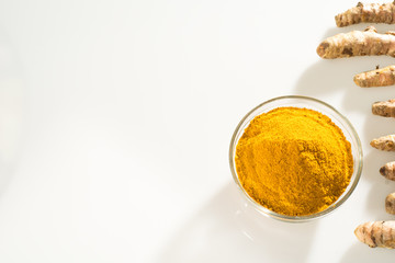 Roots and turmeric powder - Curcuma Turmeric root (curcumin) white background