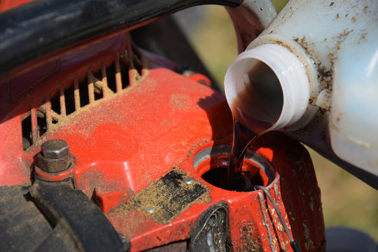 Refueling Chainsaw - Powered by Adobe
