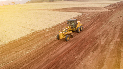 Tractor and plowing the ground for a future plantation. Tractor plowing and preparing the soil.