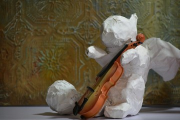 paper mache squirrel playing instrument