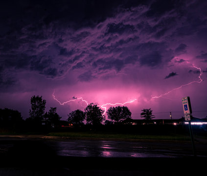 Pink Lightning Under Dark Clouds