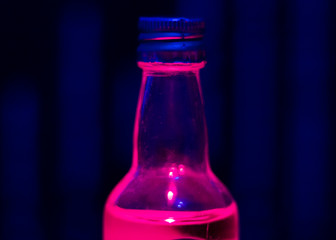 pink bottle on blue