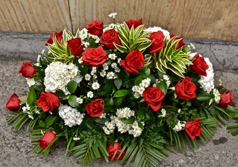bouquet of red roses on wooden background