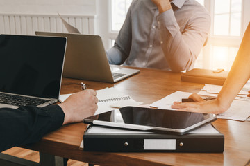 Business people analyzing investment graph meeting brainstorming and discussing plan in meeting room, investment concept