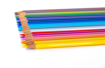 Colored pencils on white background