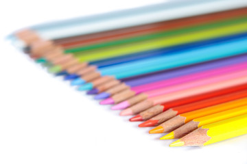 Colored pencils on white background