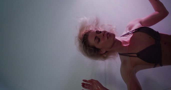 Collection featuring a young woman enjoying  a salt water float tank.  One of the newest trends in spa health and wellness!  Shot on a RED Gemini in 5K.