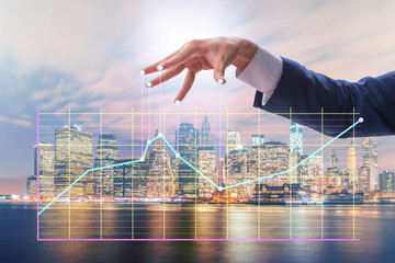 Businessman controlling the market with strings