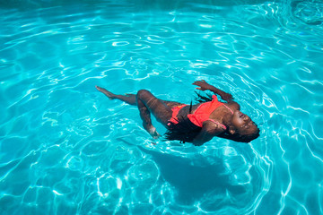 Girl in Pool with Braids