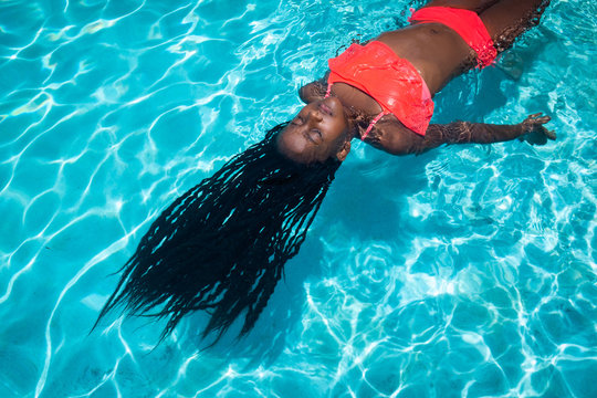 Girl in Pool with Braids