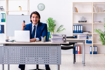 Young businessman sitting and working in the office