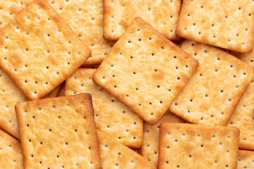 Crushed dry cracker cookies isolated on white background.