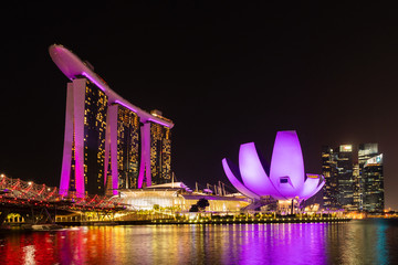 Singapore at night time. Views of Marina Bay at night with colorful light from hotels and buildings around Marina Bay.