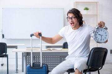 Young male student in front of whiteboard