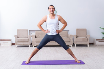 Young man training and exercising at home