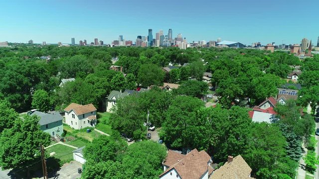 Aerial drone landscape of downtown Minneapolis, Minnesota with skyscraper buildings and city homes. Prores file, shot in 4K.