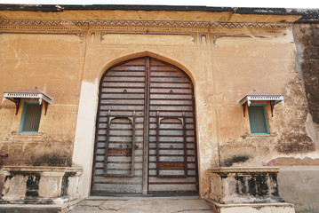 Fototapeta na wymiar Local house doors in Mandawa, Jaipur, India. Traditional architecture is Haveli