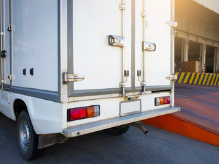 steel door with security lock of a truck cargo parking at warehouse. freight industry delivery and logistics.