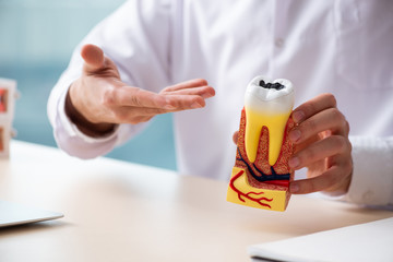 Male doctor stomatologist working in the clinic