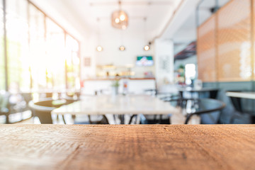 wood table in restaurant and blurred interior decor