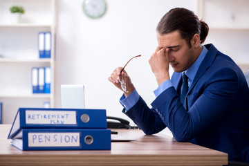 Young male accountant working in the office
