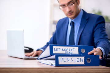 Young male accountant working in the office