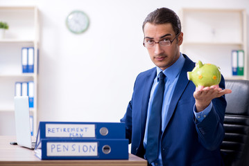 Young male accountant working in the office