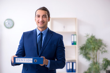 Young male accountant working in the office