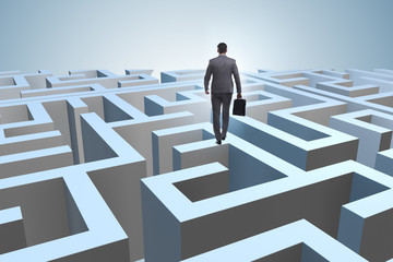 Businessman trying to escape from maze