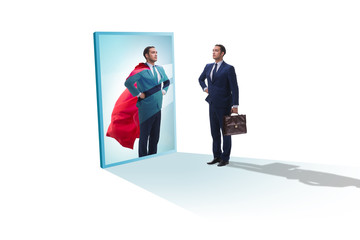Fototapeta premium Businessman seeing himself in mirror as superhero