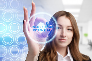 The concept of business, technology, the Internet and the network. A young entrepreneur working on a virtual screen of the future and sees the inscription: Unlock your potential