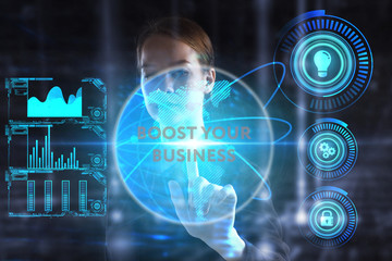 The concept of business, technology, the Internet and the network. A young entrepreneur working on a virtual screen of the future and sees the inscription: Boost your business