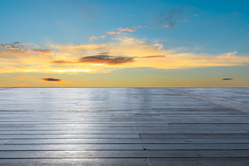 Fototapeta na wymiar Wooden board square and beautiful sunset clouds
