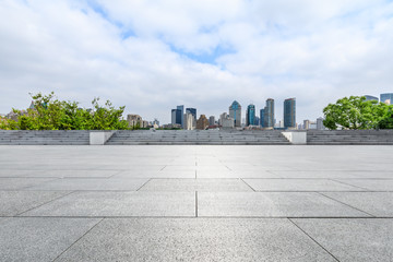 Shanghai skyline and empty square floor in city park