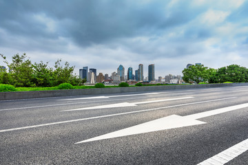 Fototapeta premium Empty asphalt highway and city skyline with buildings in Shanghai,China.