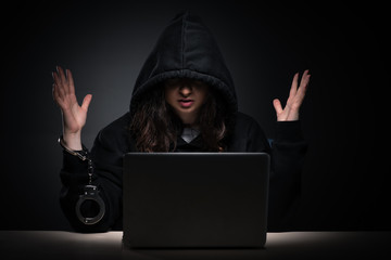 Female hacker hacking security firewall late in office