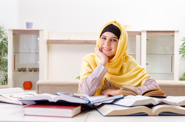 Female student in hijab preparing for exams