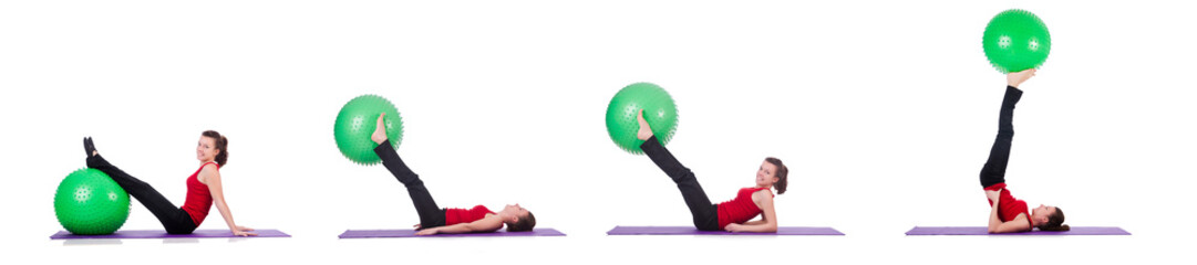 Young woman exercising with swiss ball