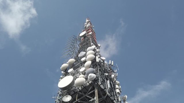 Tower for telecommunications, television broadcast, cellphone, radio and satellite on Linzone mountain peak. Telecommunication center. Electromagnetic and environmental pollution. Italian Alps. Italy