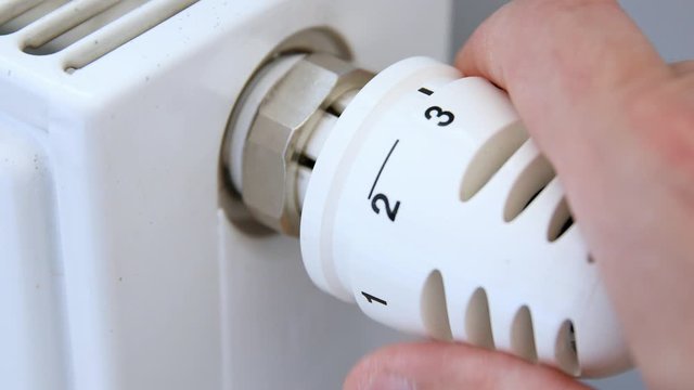 Adjusting Heating Thermostat By Hand, 4k