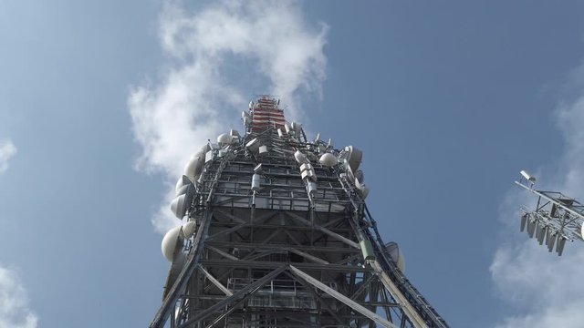 Tower for telecommunications, television broadcast, cellphone, radio and satellite on Linzone mountain peak. Telecommunication center. Electromagnetic and environmental pollution. Italian Alps. Italy
