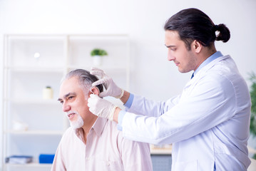 Male patient with hearing problem visiting doctor otorhinolaryng