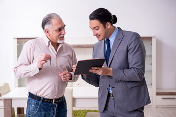 Male real estate agent and male client in the apartment