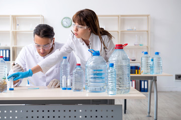 Fototapeta premium Two chemists working in the lab