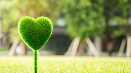 Green heart floats on the air with clean oxygen. Which shows the care of nature in growing trees And reduce the of materials made from forests Use environmentally friendly materials Environmental day