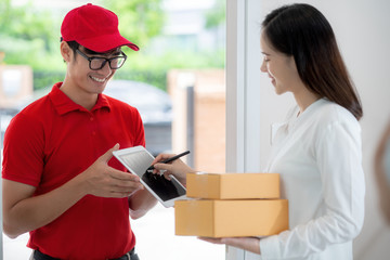 Asian girl sign for recieve mail box from online shopping at home