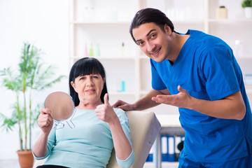Fototapeta premium Old woman visiting male doctor for plastic surgery