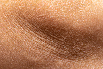 macro close up view of a human skin with wrinkles on caucasian women body
